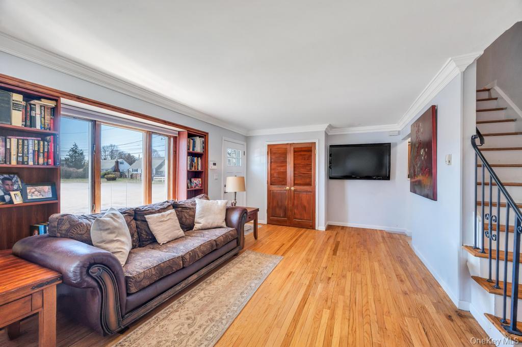 398 33rd Street Lindenhurst, NY 11757 - Photo 15 of 44 a living room with furniture and a flat screen tv