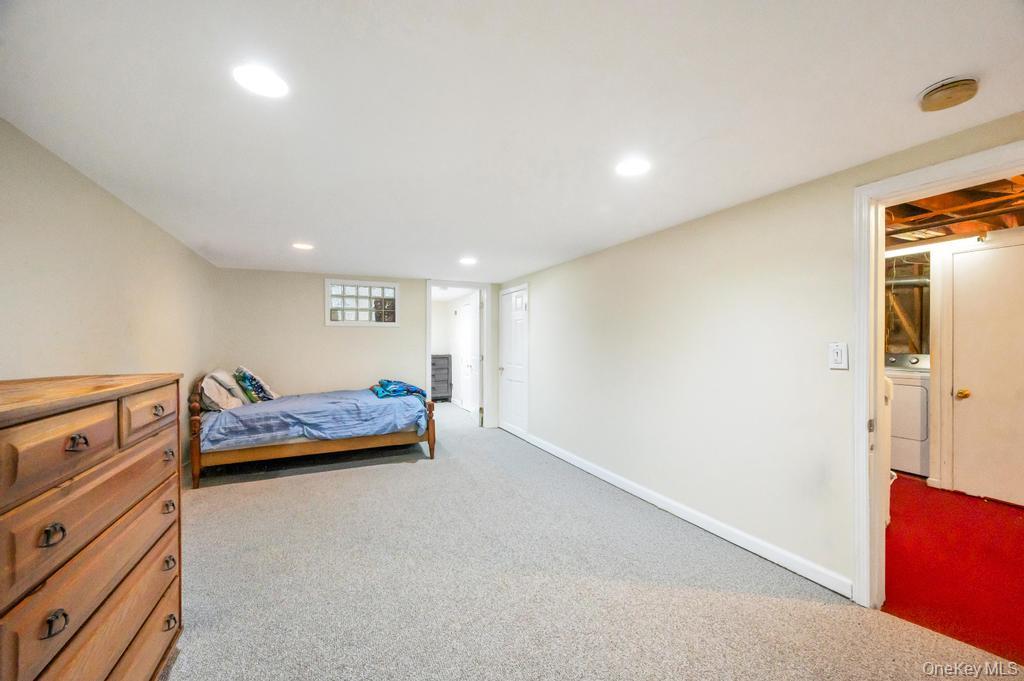 398 33rd Street Lindenhurst, NY 11757 - Photo 37 of 44 a bedroom with furniture and a dresser