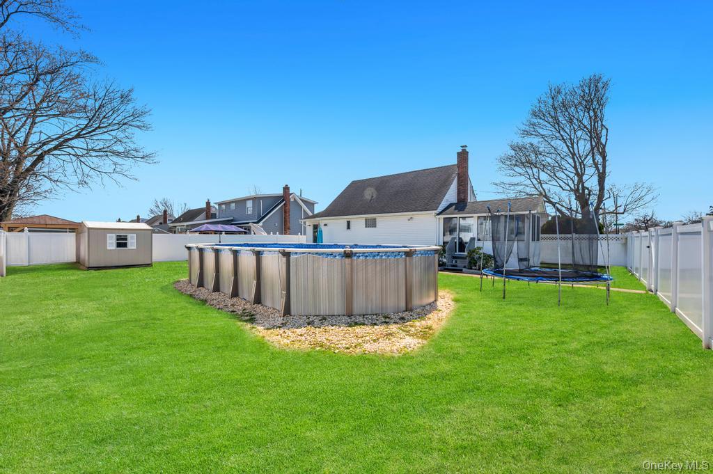 398 33rd Street Lindenhurst, NY 11757 - Photo 7 of 44 a view of a house with a yard and deck