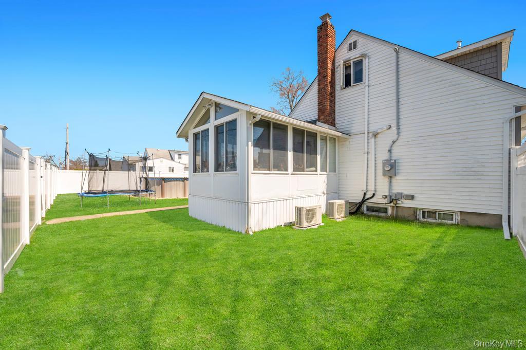 398 33rd Street Lindenhurst, NY 11757 - Photo 10 of 44 a front view of a house with a garden