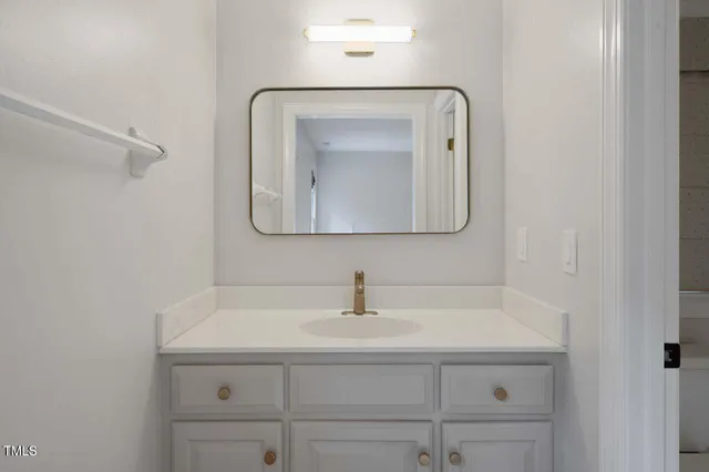 an empty room with windows and entrance