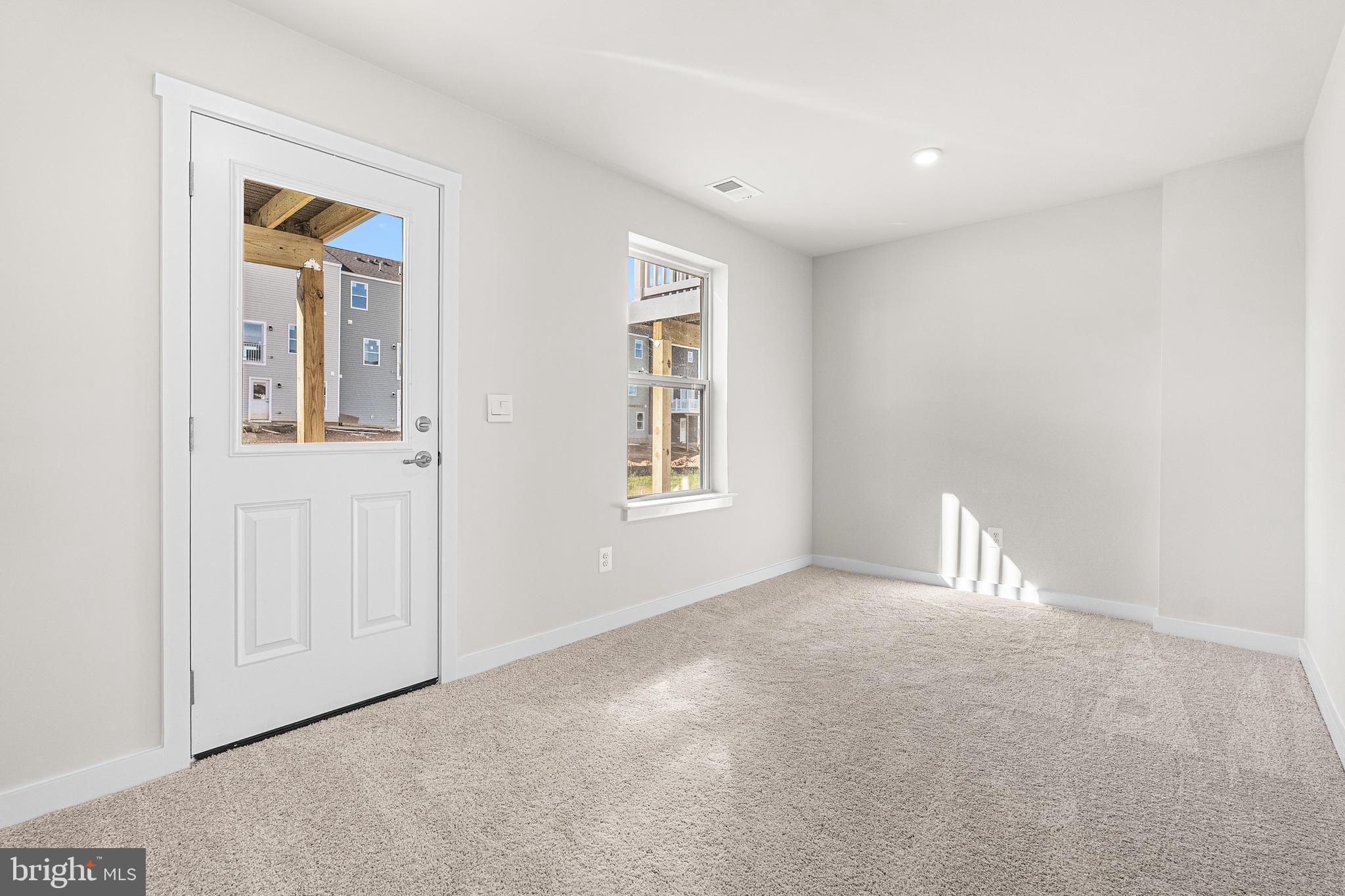 1985 Huntwell W Avenue Ranson, WV 25438 - Photo 19 of 20 an empty room with windows and closet
