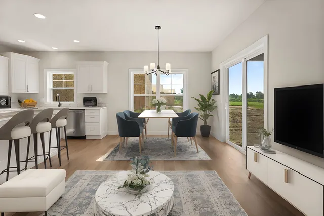 a view of a room with kitchen wooden floor and windows