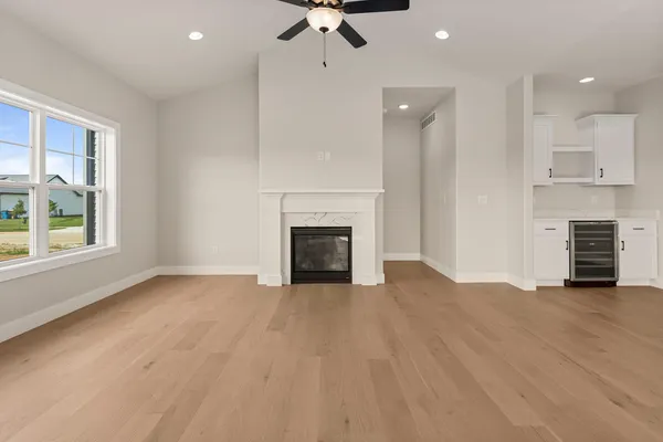 a view of a kitchen with a sink and a fireplace
