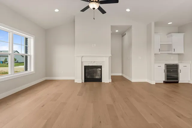 a view of a kitchen with a sink and a fireplace