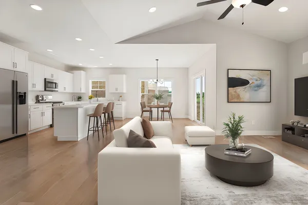 a view of a kitchen with a sink a refrigerator and window
