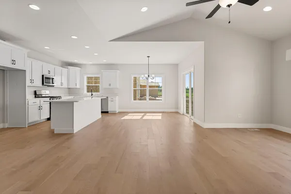 a bedroom with bed and a couch