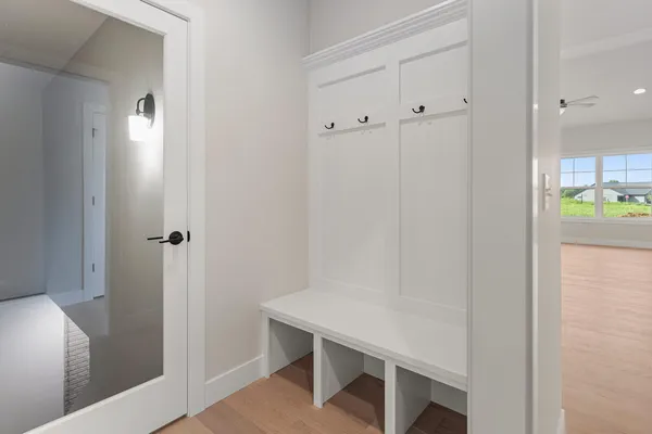 a view of empty room with wooden floor