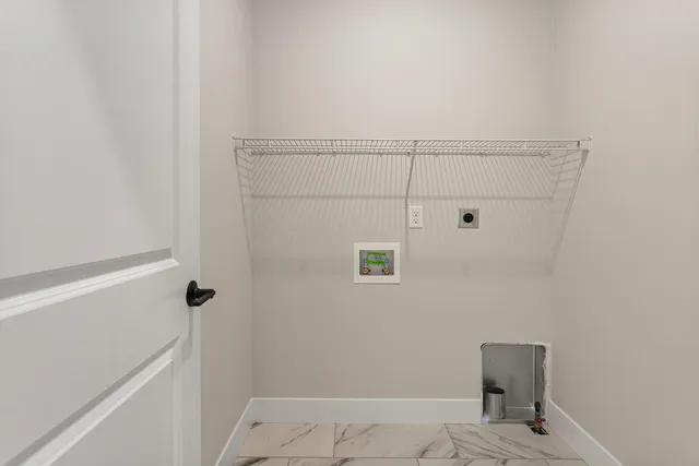 a view of a room with wooden walls