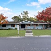 a front view of a house with a yard