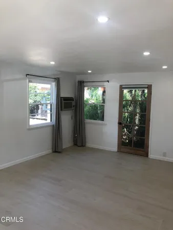 a kitchen with stainless steel appliances a sink a stove a microwave and cabinets