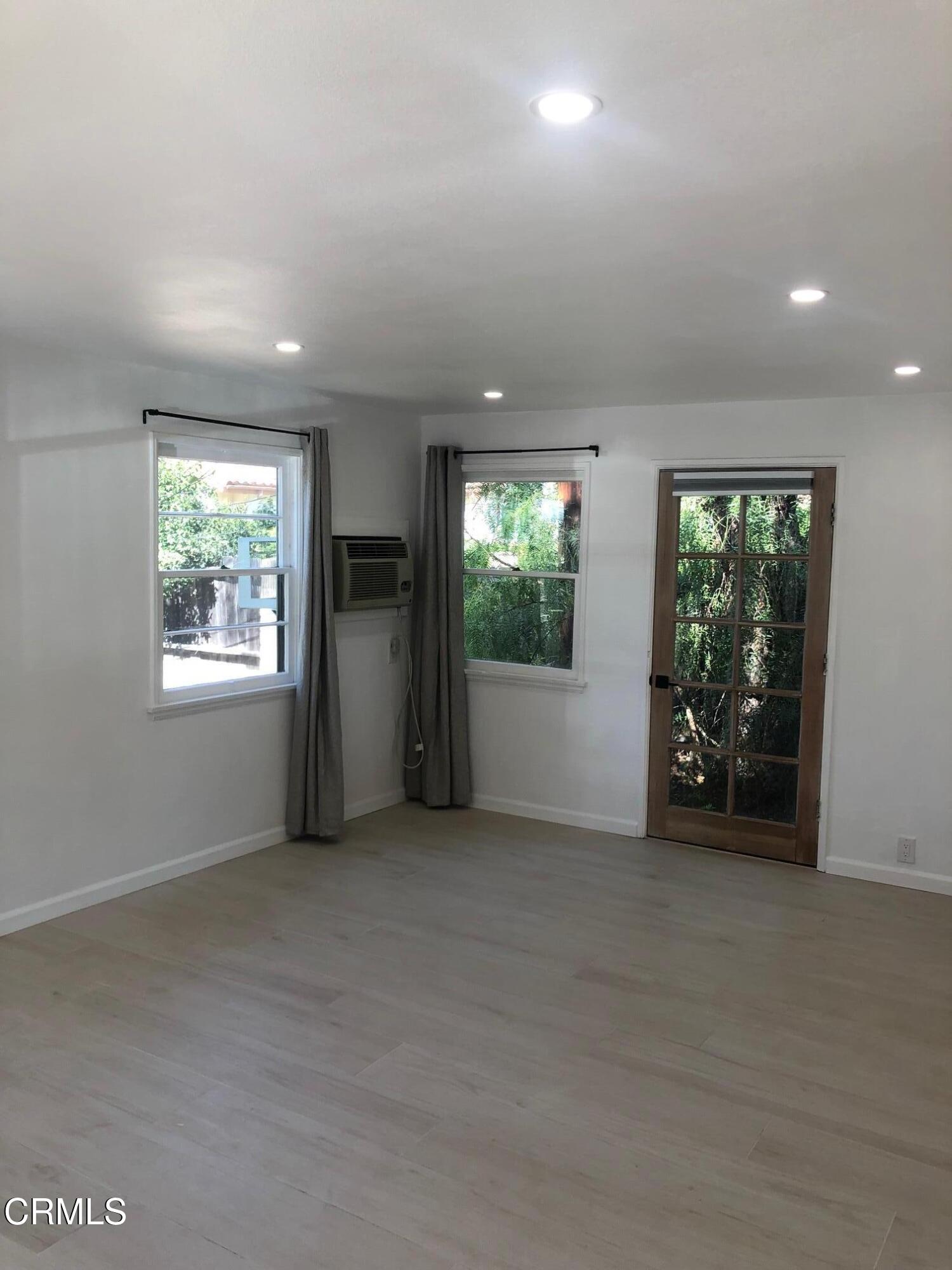 412 Mallory Way, Unit 16 Ojai, CA 93023 - Photo 4 of 13 an empty room with windows