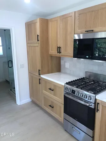 a bathroom with a shower and toilet