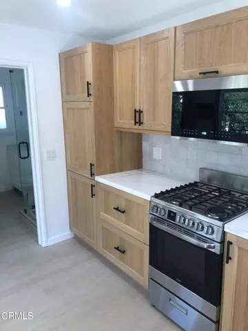 a bathroom with a shower and toilet