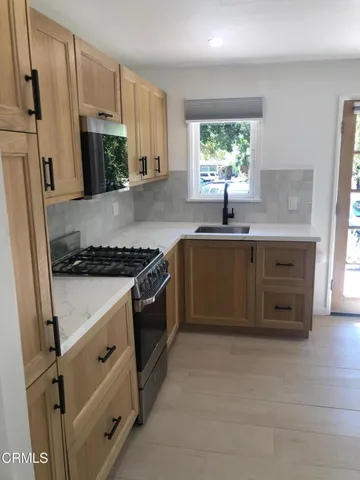 a bathroom with a sink and mirror