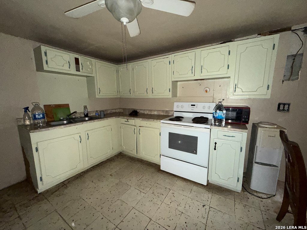 3148 Leonel Street Eagle Pass, TX 78852 - Photo 3 of 18 a kitchen with cabinets appliances and a sink