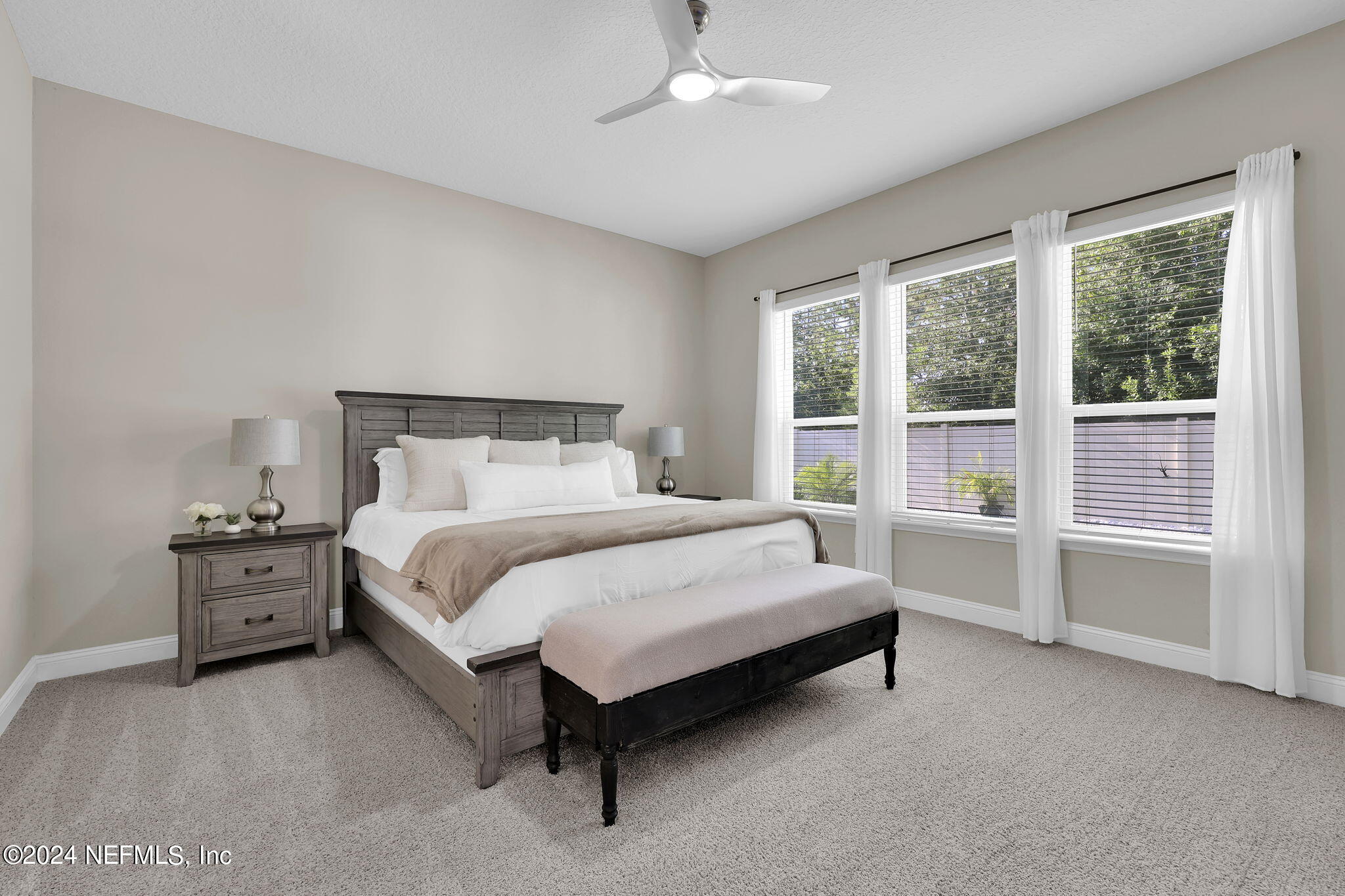 100 Calliel Way St. Johns, FL 32259 - Photo 11 of 50 a bed sitting in a bedroom next to a window