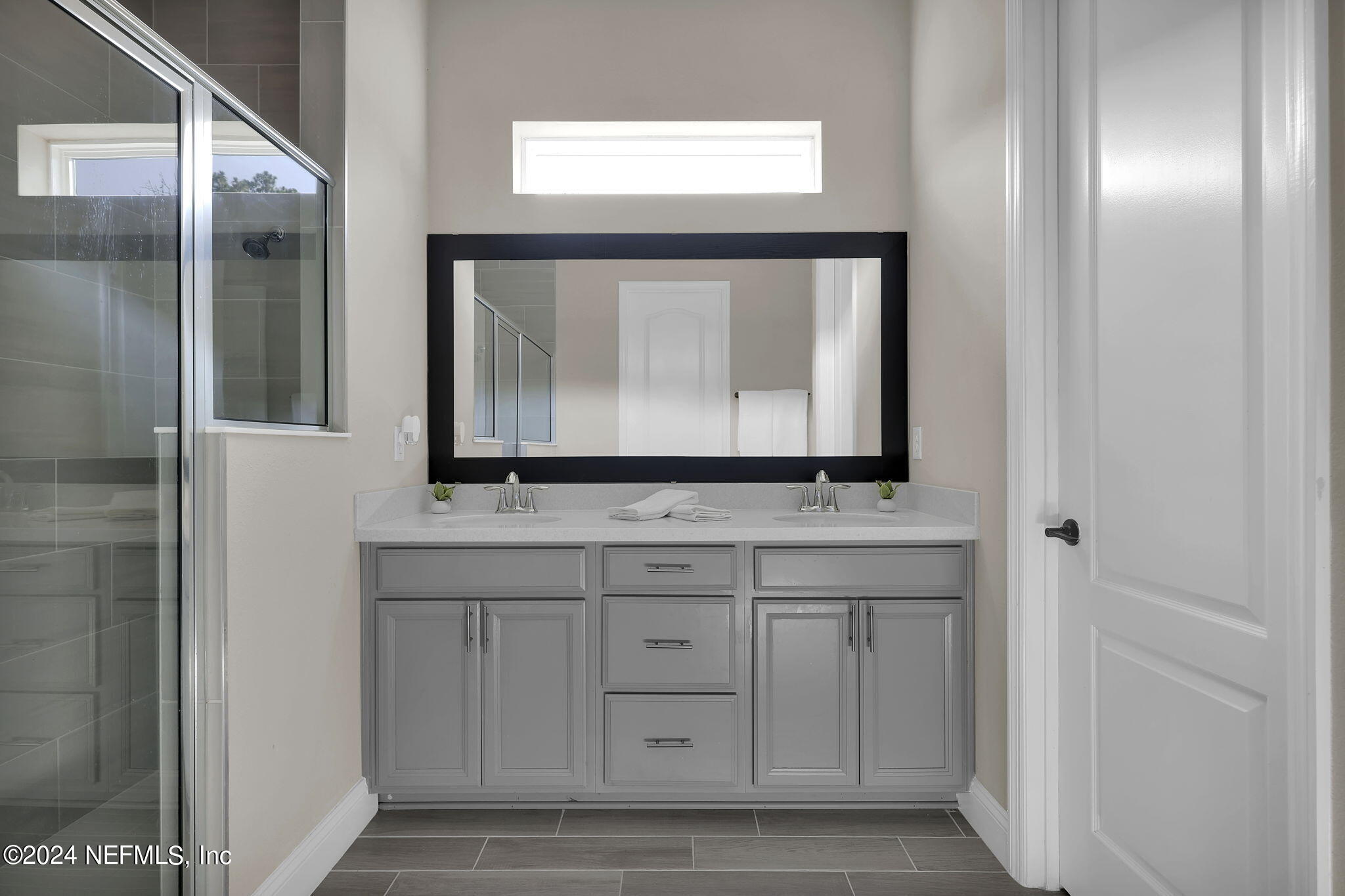 100 Calliel Way St. Johns, FL 32259 - Photo 14 of 50 a bathroom with a sink and a mirror