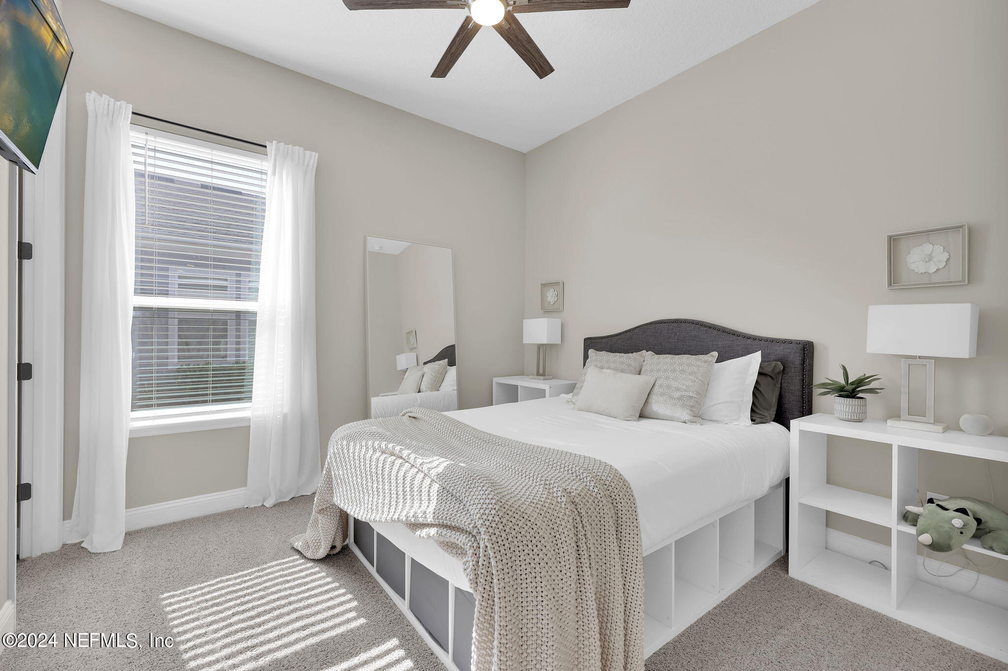 100 Calliel Way St. Johns, FL 32259 - Photo 18 of 50 a bedroom with a bed a lamp and a window