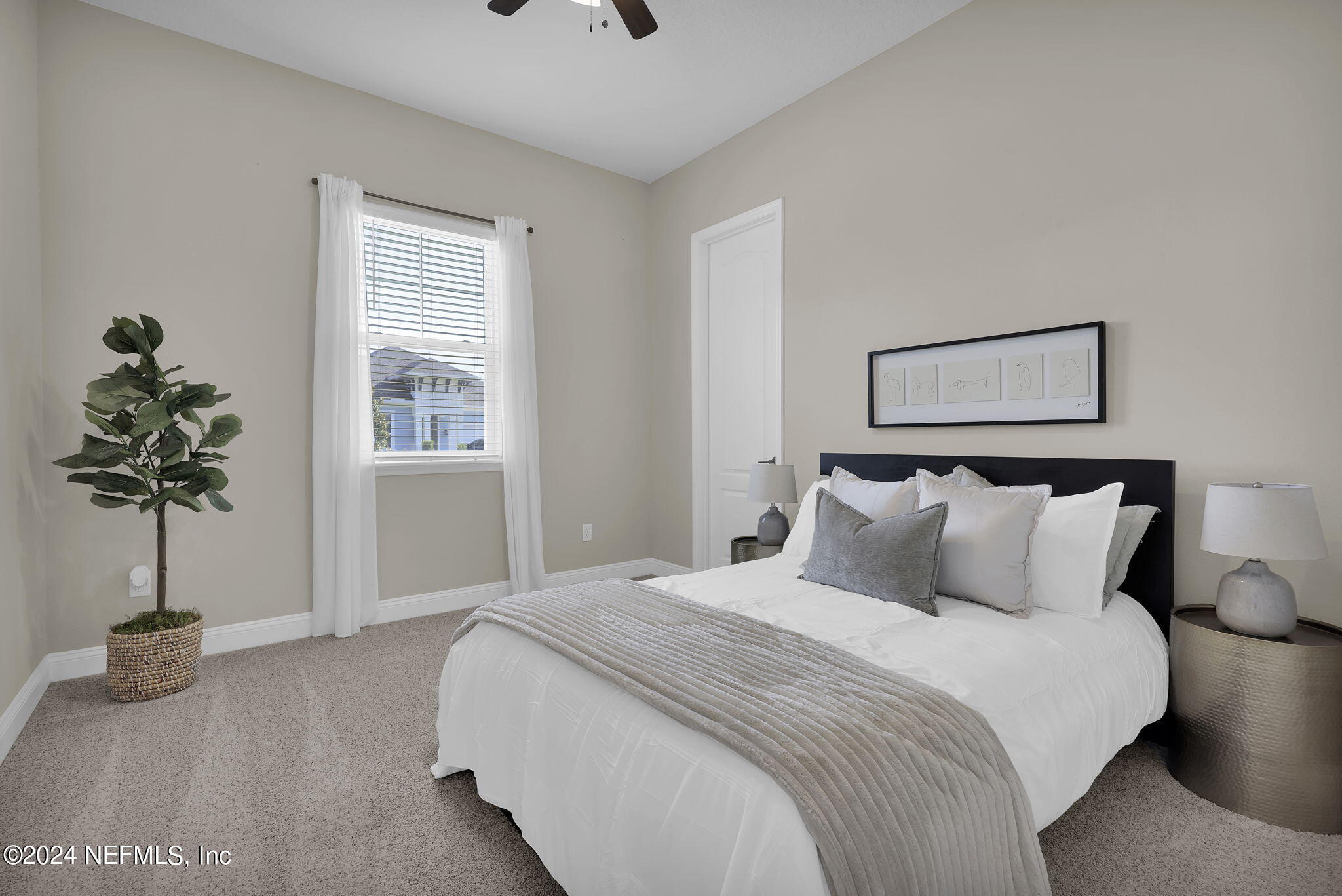 100 Calliel Way St. Johns, FL 32259 - Photo 20 of 50 a bedroom with bed and a potted plant