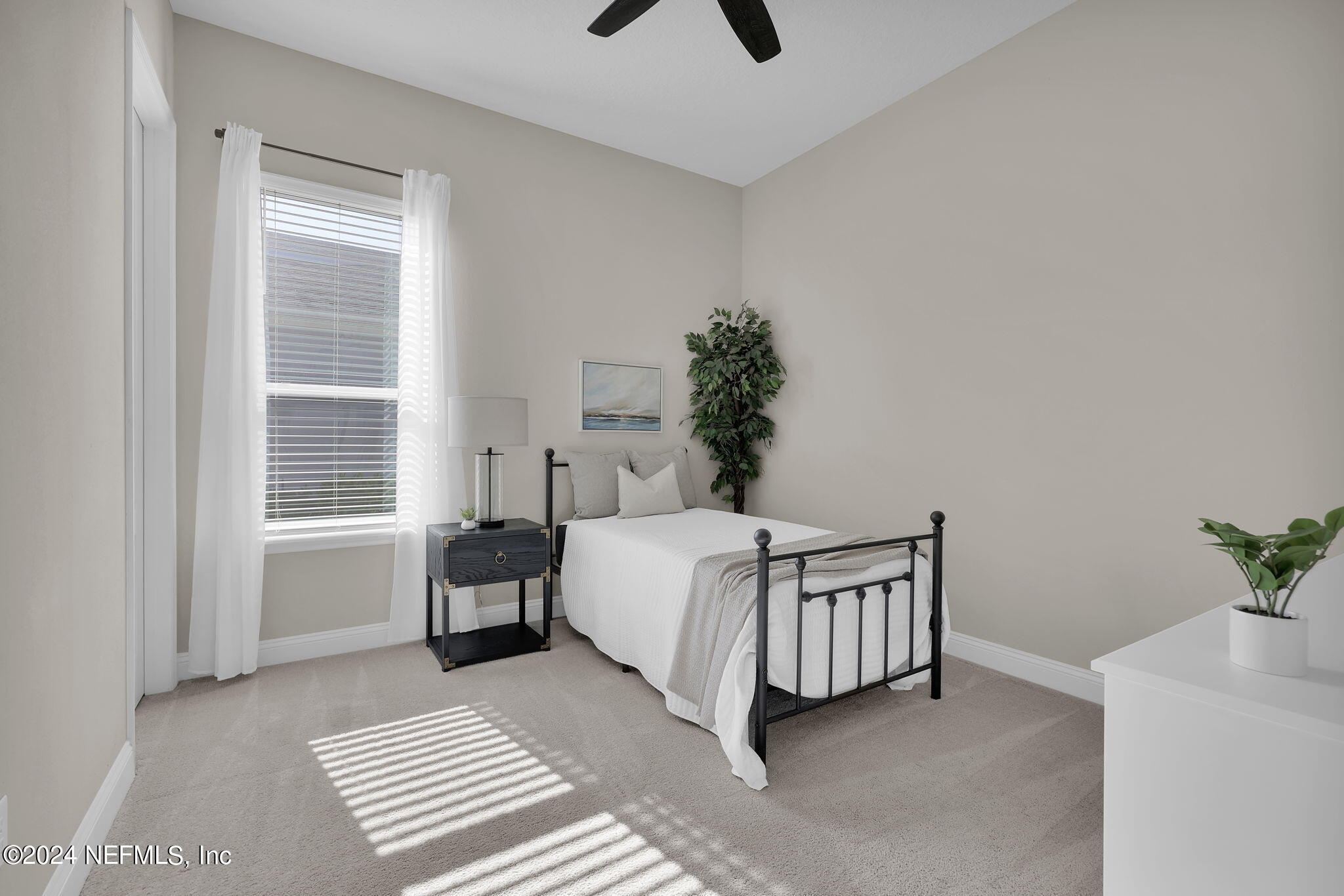 100 Calliel Way St. Johns, FL 32259 - Photo 21 of 50 a bed sitting in a bedroom next to a window and a dresser