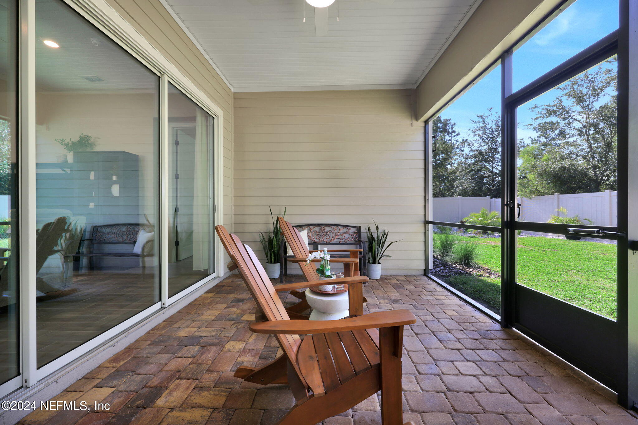100 Calliel Way St. Johns, FL 32259 - Photo 26 of 50 a view of a porch with chairs and backyard