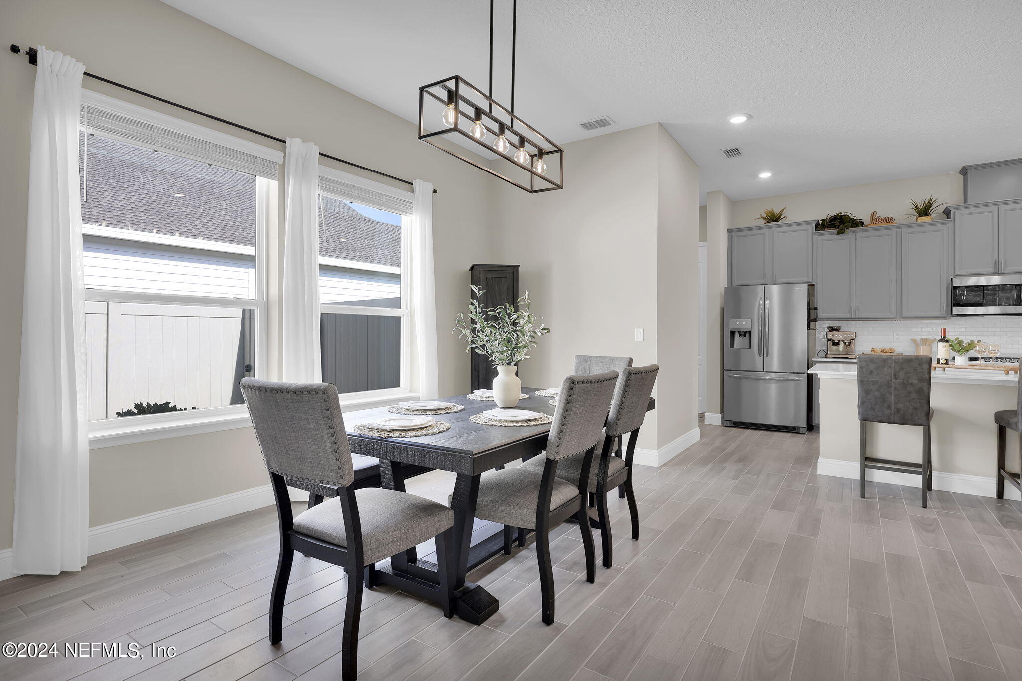100 Calliel Way St. Johns, FL 32259 - Photo 9 of 50 a view of a dining room with furniture large window and wooden floor