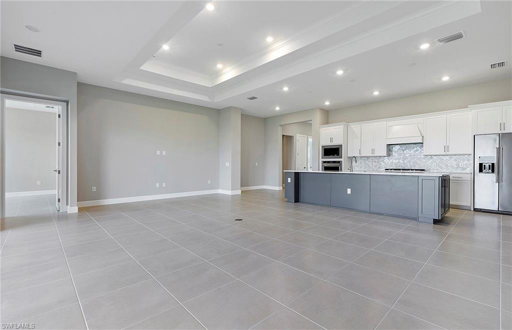20039 Nickel Trail Alva, FL 33920 - Photo 13 of 50 a kitchen with stainless steel appliances a refrigerator sink and cabinets