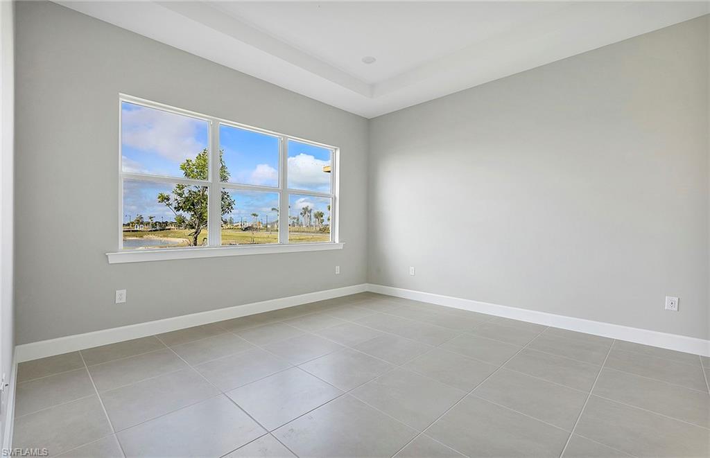 20039 Nickel Trail Alva, FL 33920 - Photo 14 of 50 an empty room with windows and painting on the wall