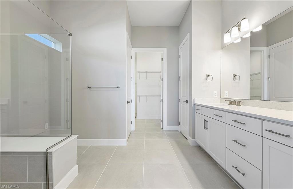 20039 Nickel Trail Alva, FL 33920 - Photo 16 of 50 a spacious bathroom with a shower a sink and a mirror