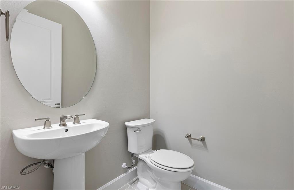 20039 Nickel Trail Alva, FL 33920 - Photo 22 of 50 a bathroom with a sink a toilet and mirror