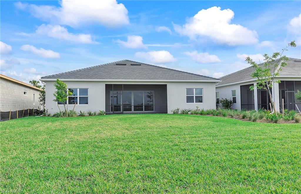 20039 Nickel Trail Alva, FL 33920 - Photo 24 of 50 a front view of a house with garden