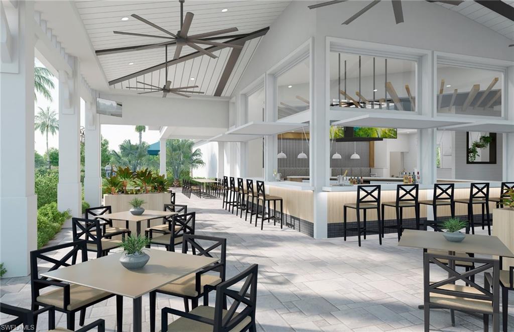 20039 Nickel Trail Alva, FL 33920 - Photo 40 of 50 a view of a dining area with furniture large windows and wooden floor