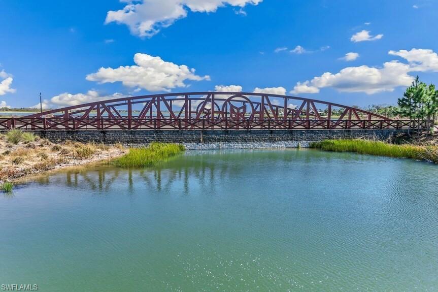 20039 Nickel Trail Alva, FL 33920 - Photo 45 of 50 a view of a swimming pool with outdoor seating and a lake view