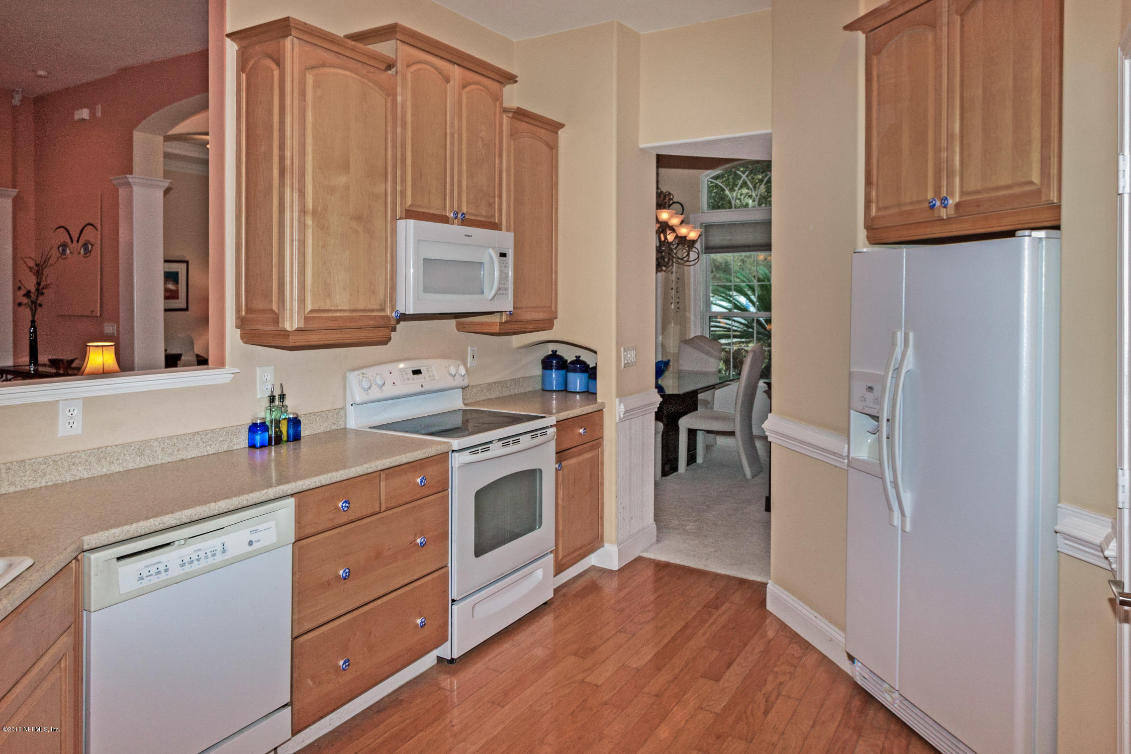 3357 Kings Road South St. Augustine, FL 32086 - Photo 12 of 31 a kitchen with a refrigerator stove and sink