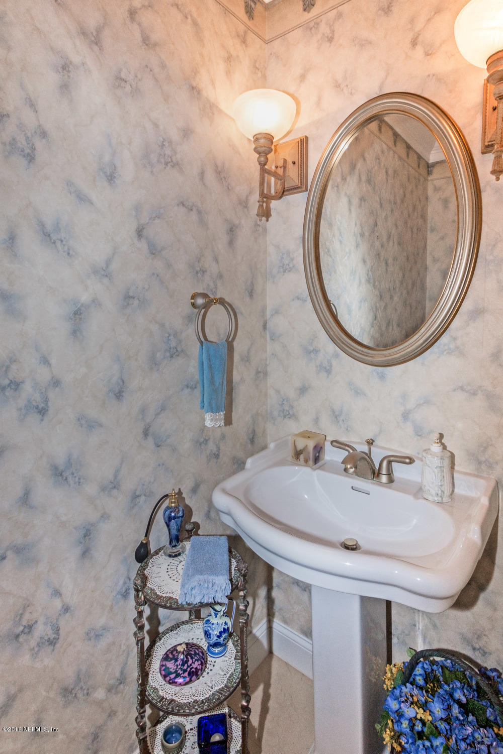 3357 Kings Road South St. Augustine, FL 32086 - Photo 14 of 31 a bathroom with a sink and a mirror