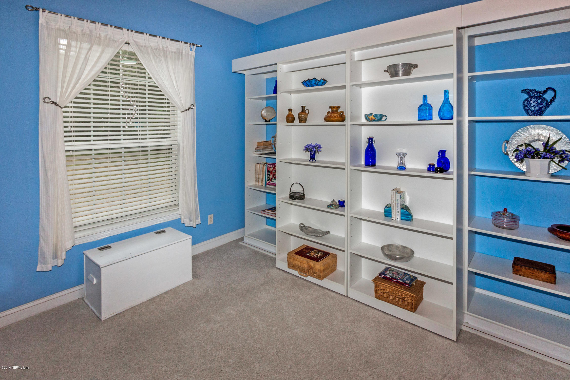 3357 Kings Road South St. Augustine, FL 32086 - Photo 21 of 31 a room with a baby crib and a window