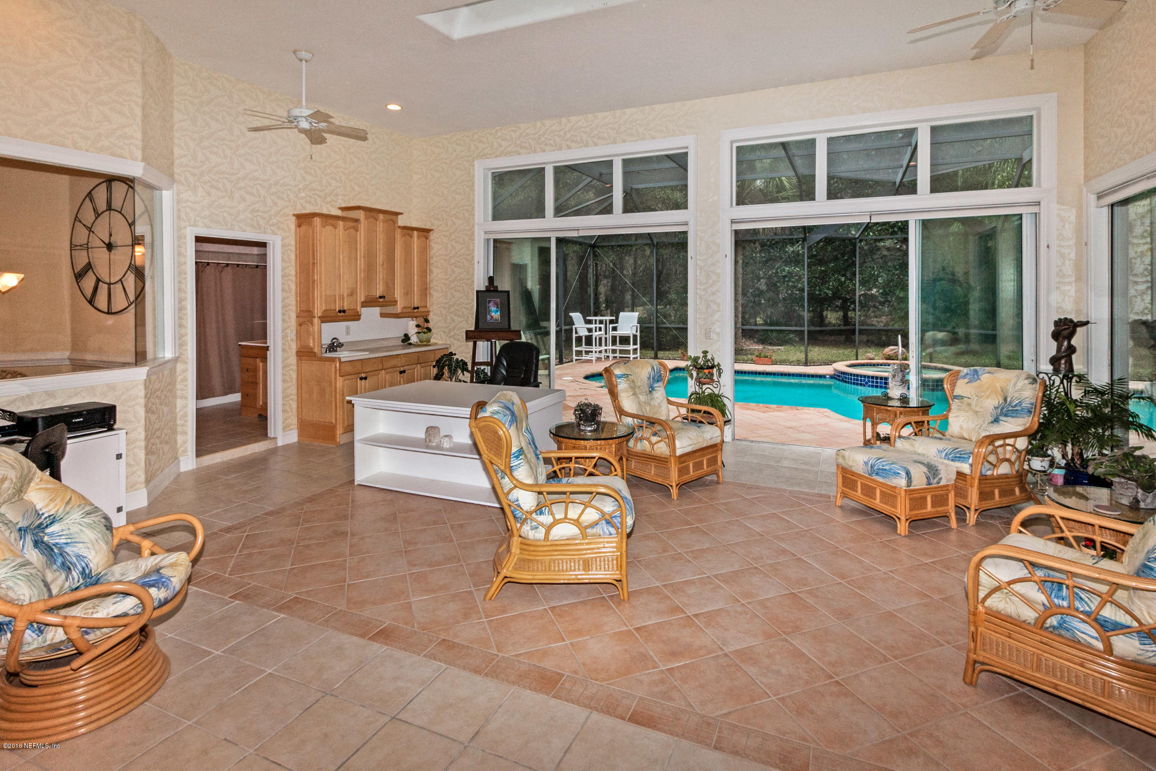 3357 Kings Road South St. Augustine, FL 32086 - Photo 23 of 31 a living room with patio furniture and floor to ceiling windows
