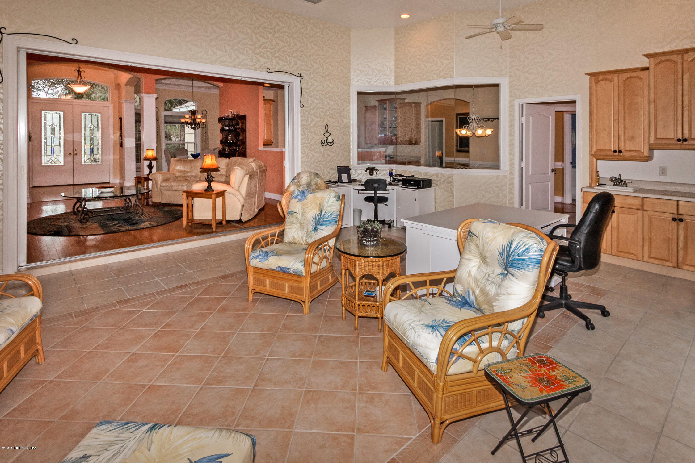 3357 Kings Road South St. Augustine, FL 32086 - Photo 25 of 31 a living room with patio furniture and a large window