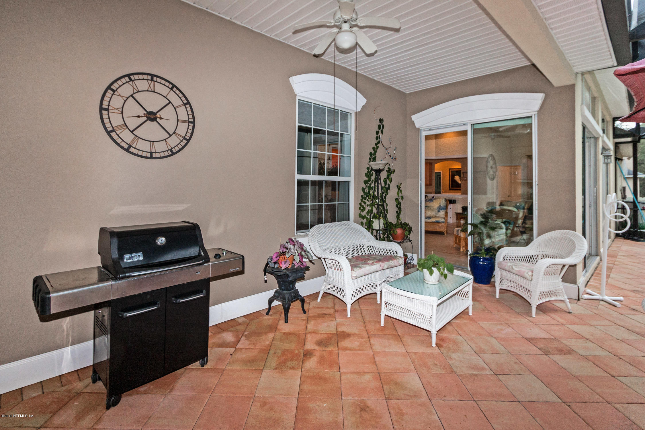 3357 Kings Road South St. Augustine, FL 32086 - Photo 26 of 31 a living room with furniture a dining table and a chandelier