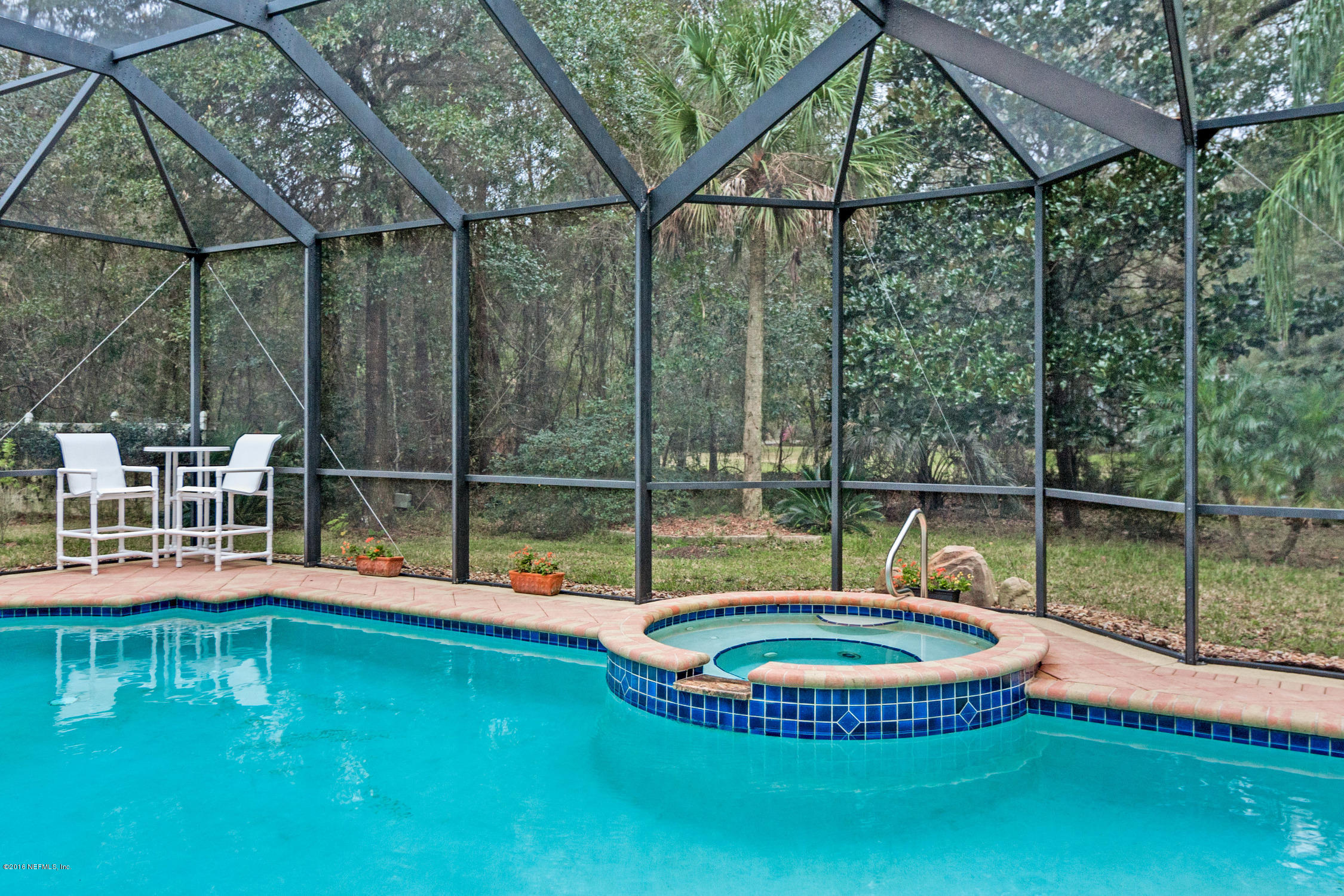 3357 Kings Road South St. Augustine, FL 32086 - Photo 28 of 31 a view of a house with a backyard and swimming pool