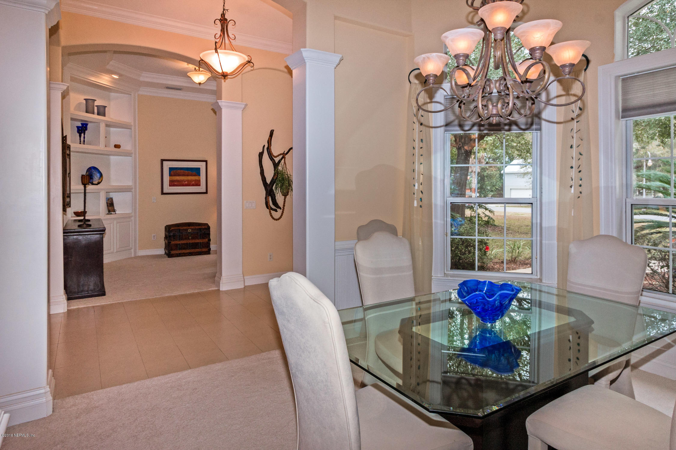 3357 Kings Road South St. Augustine, FL 32086 - Photo 6 of 31 a view of a dining room with furniture a chandelier and wooden floor