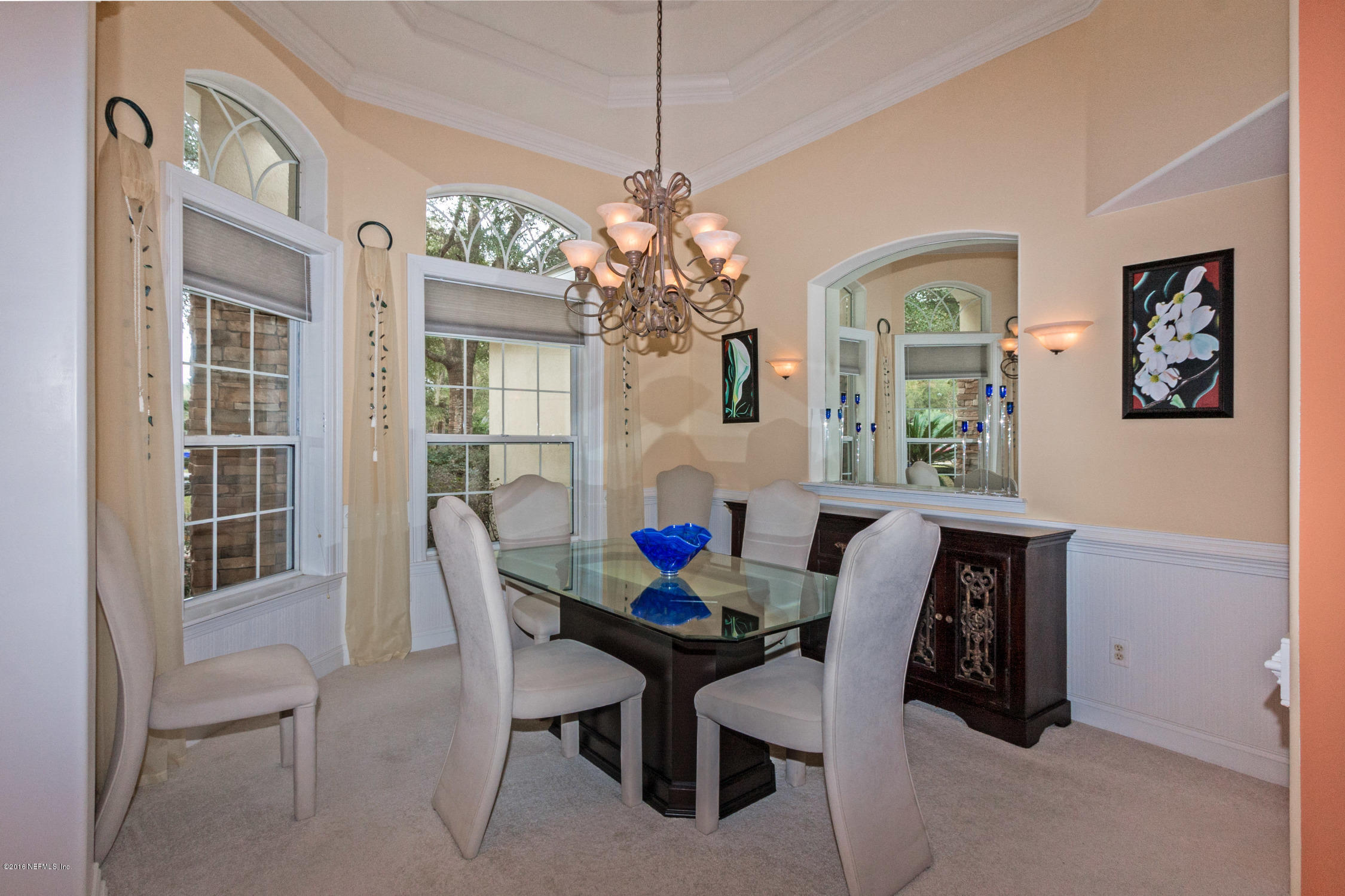 3357 Kings Road South St. Augustine, FL 32086 - Photo 7 of 31 a view of a dining room with furniture and a chandelier
