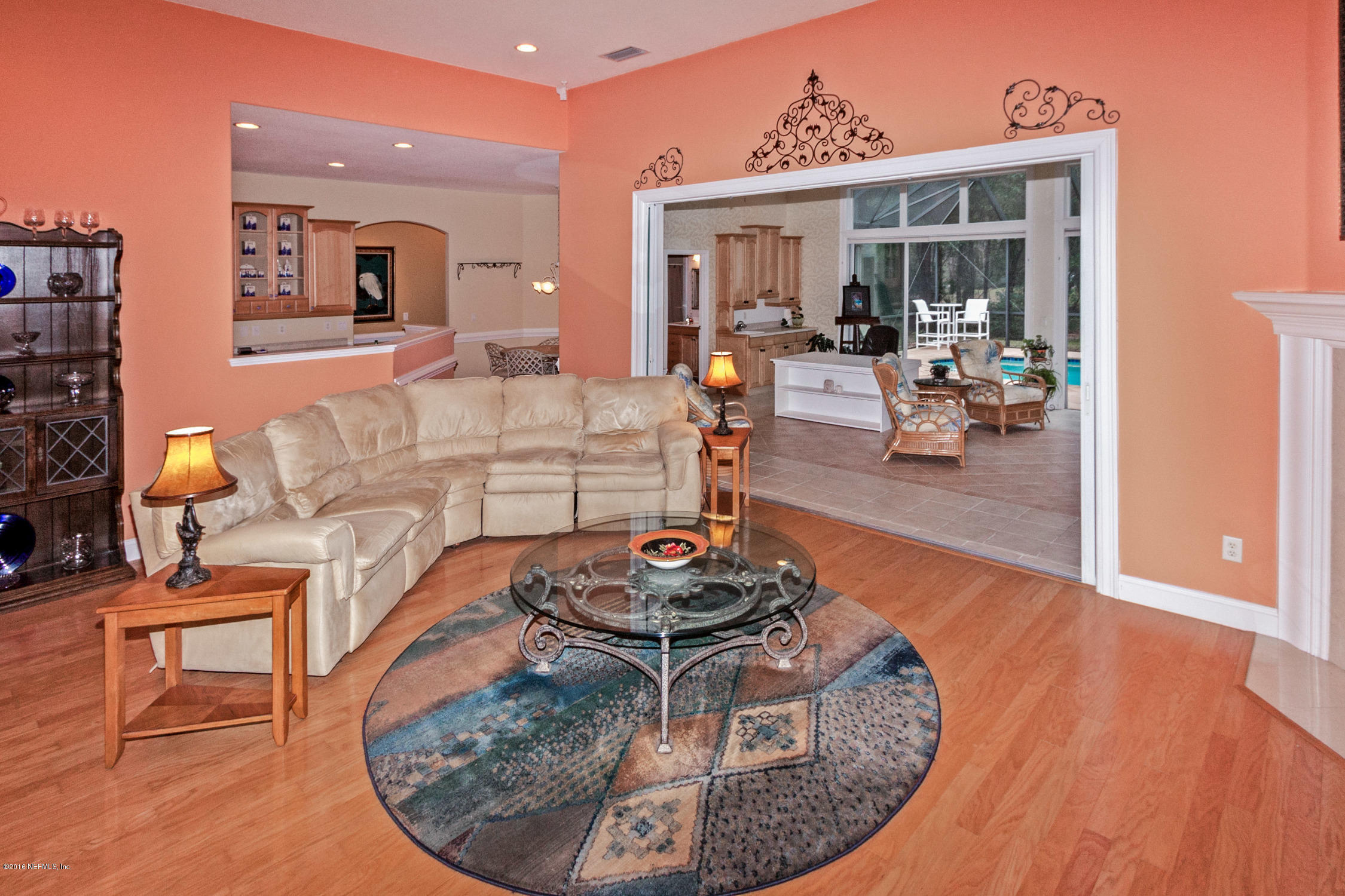 3357 Kings Road South St. Augustine, FL 32086 - Photo 9 of 31 a living room with furniture and a wooden floor