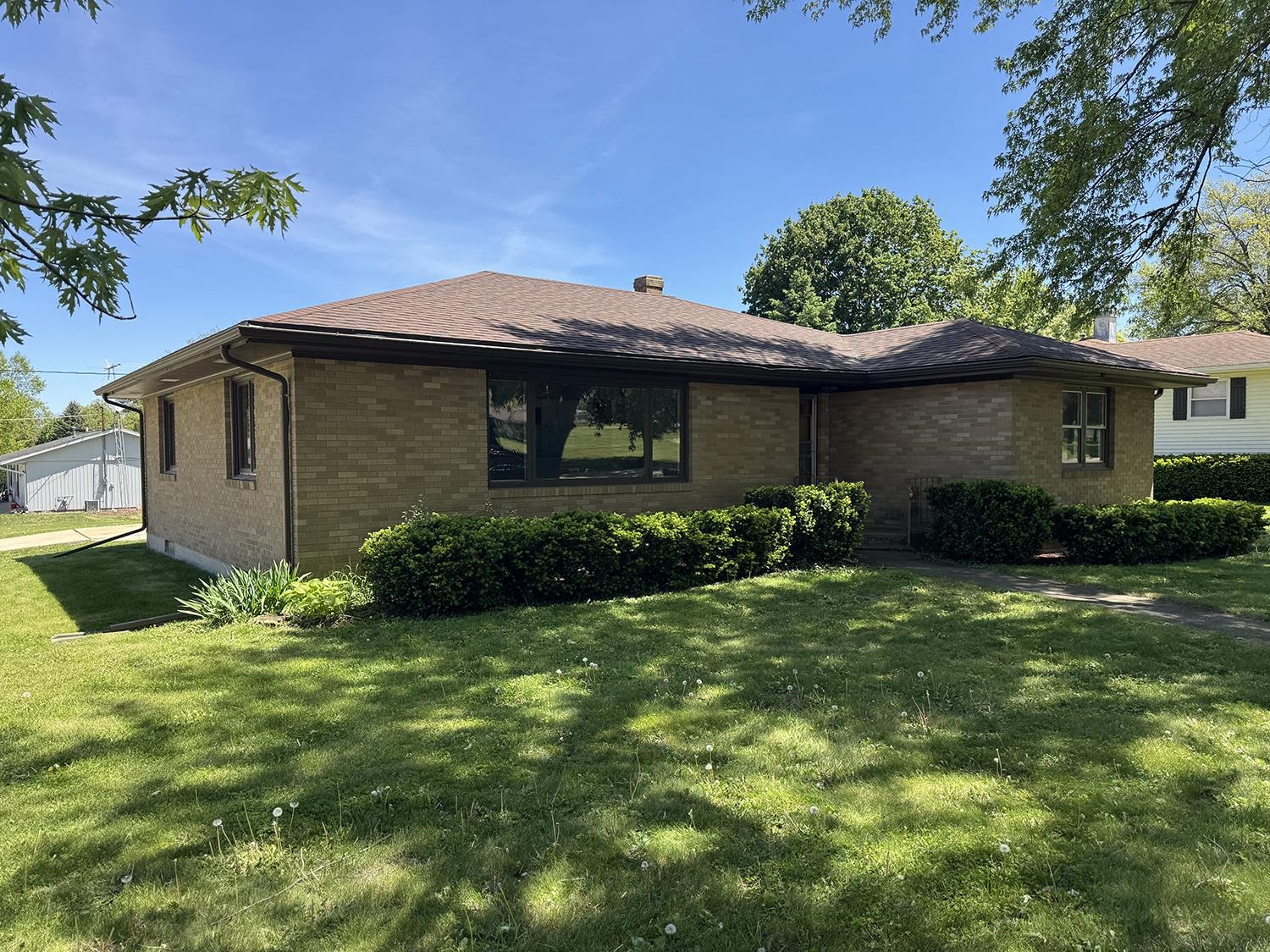 401 South Ridge Street Shannon, IL 61078 - Photo 1 of 40 a front view of a house with garden