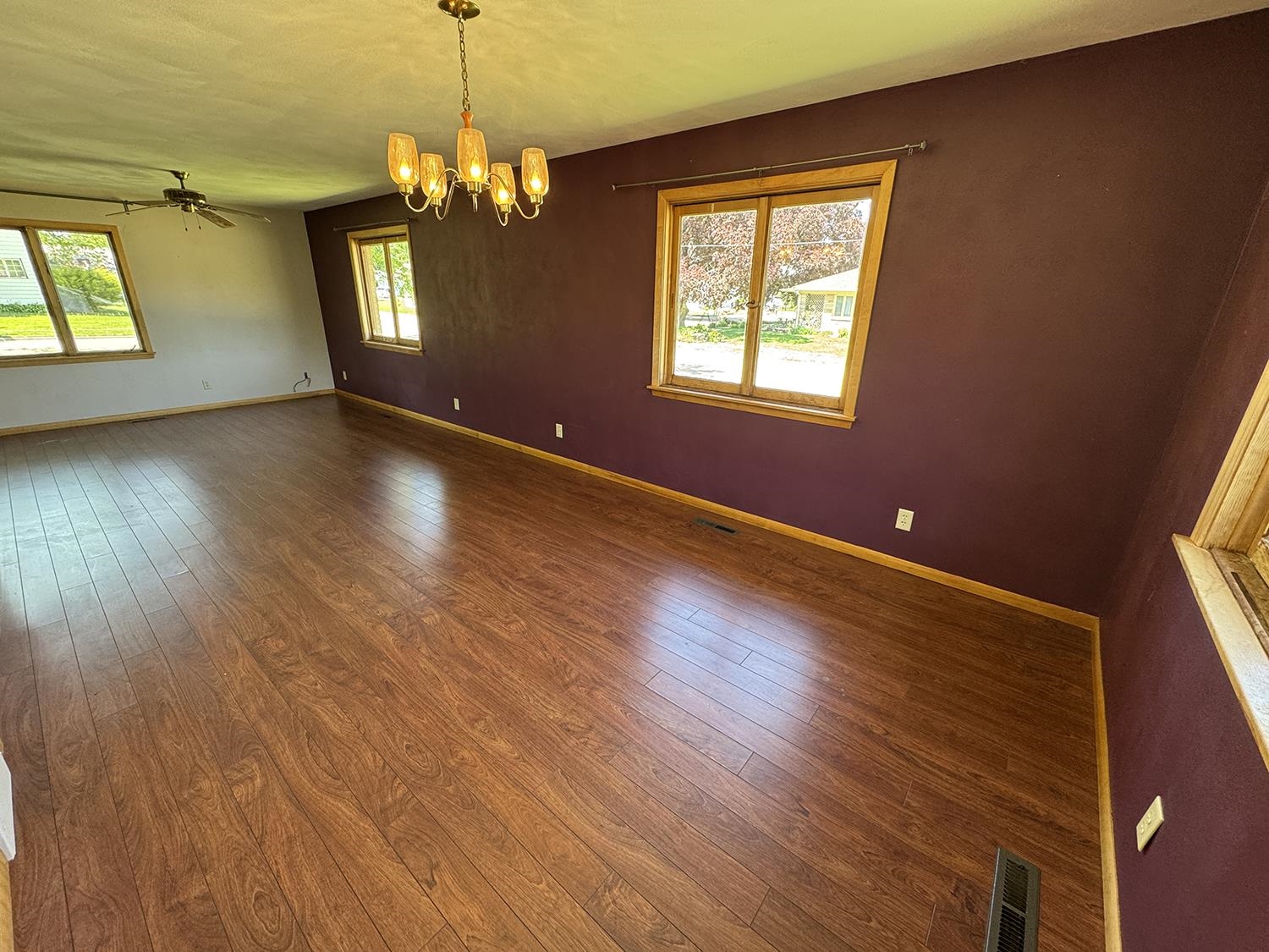 401 South Ridge Street Shannon, IL 61078 - Photo 14 of 40 a view of an empty room with wooden floor and a window
