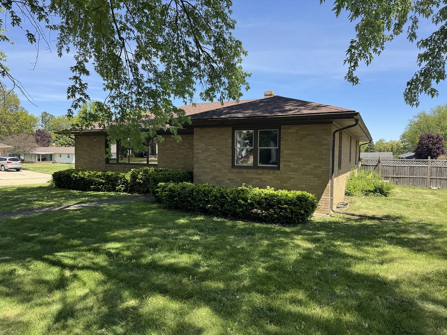 401 South Ridge Street Shannon, IL 61078 - Photo 2 of 40 a yellow house with green field