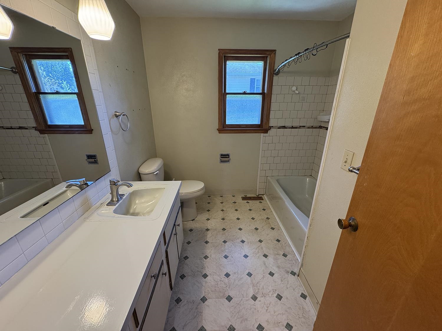 401 South Ridge Street Shannon, IL 61078 - Photo 28 of 40 a bathroom with a sink a toilet a shower and a mirror