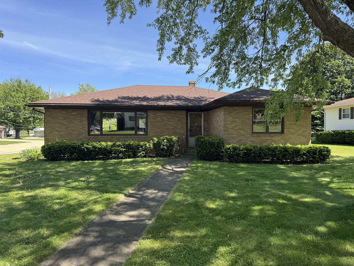 401 South Ridge Street Shannon, IL 61078 - Photo 3 of 40 a front view of a house with a garden