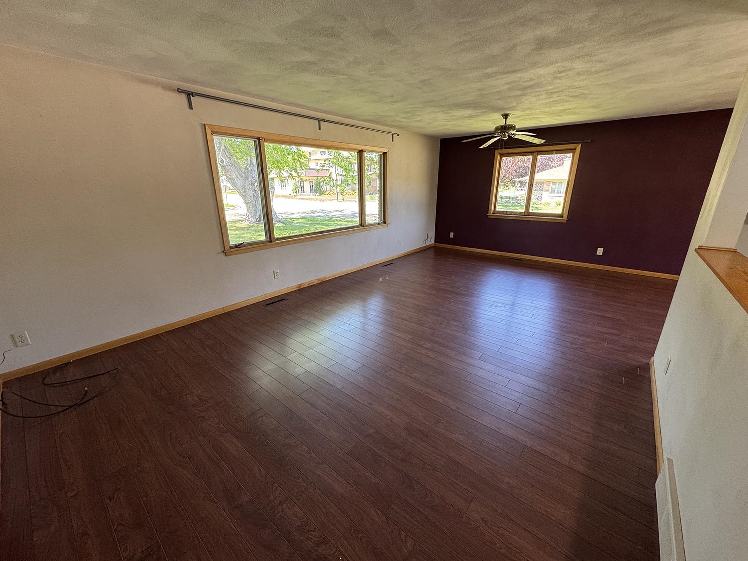 401 South Ridge Street Shannon, IL 61078 - Photo 9 of 40 a view of an empty room with wooden floor and a window